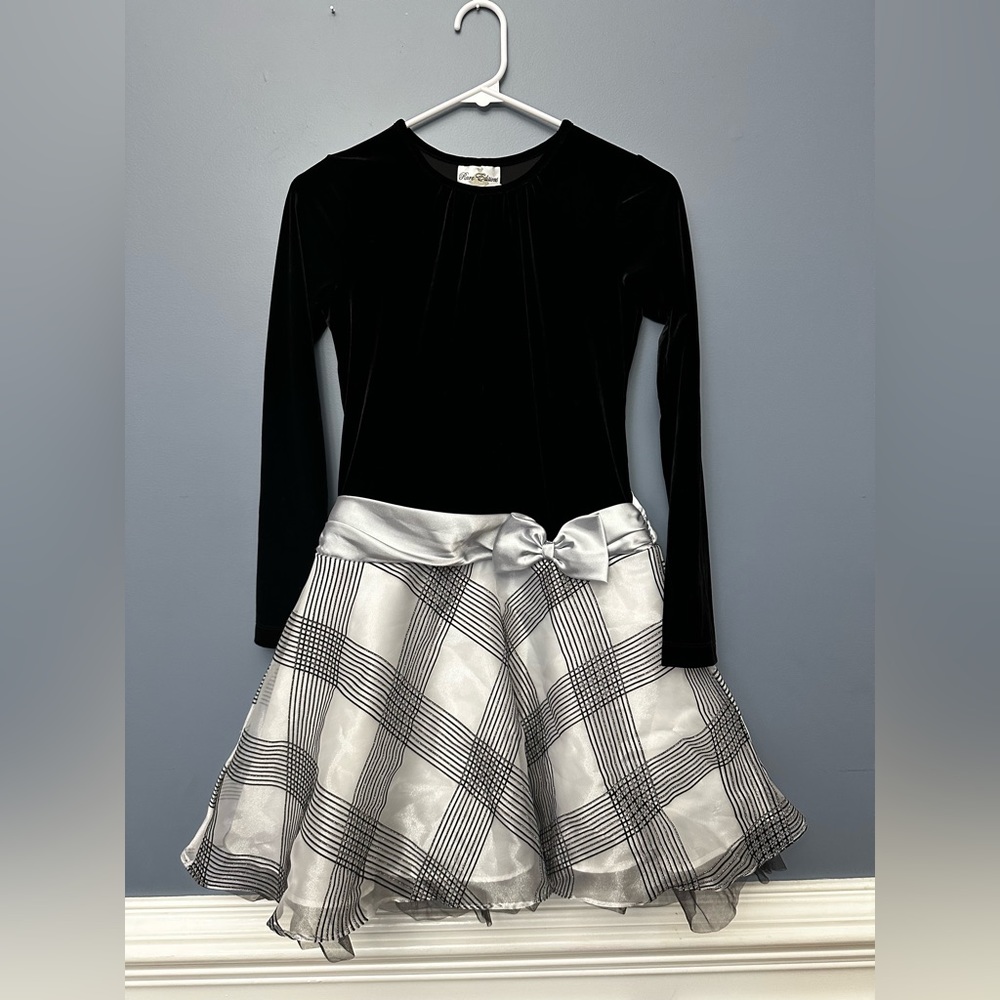 Black top dress with a silver bow and silver skirt